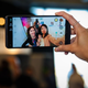 Illustration for article titled The person in this LG V20 review picture has tiny Trump hands